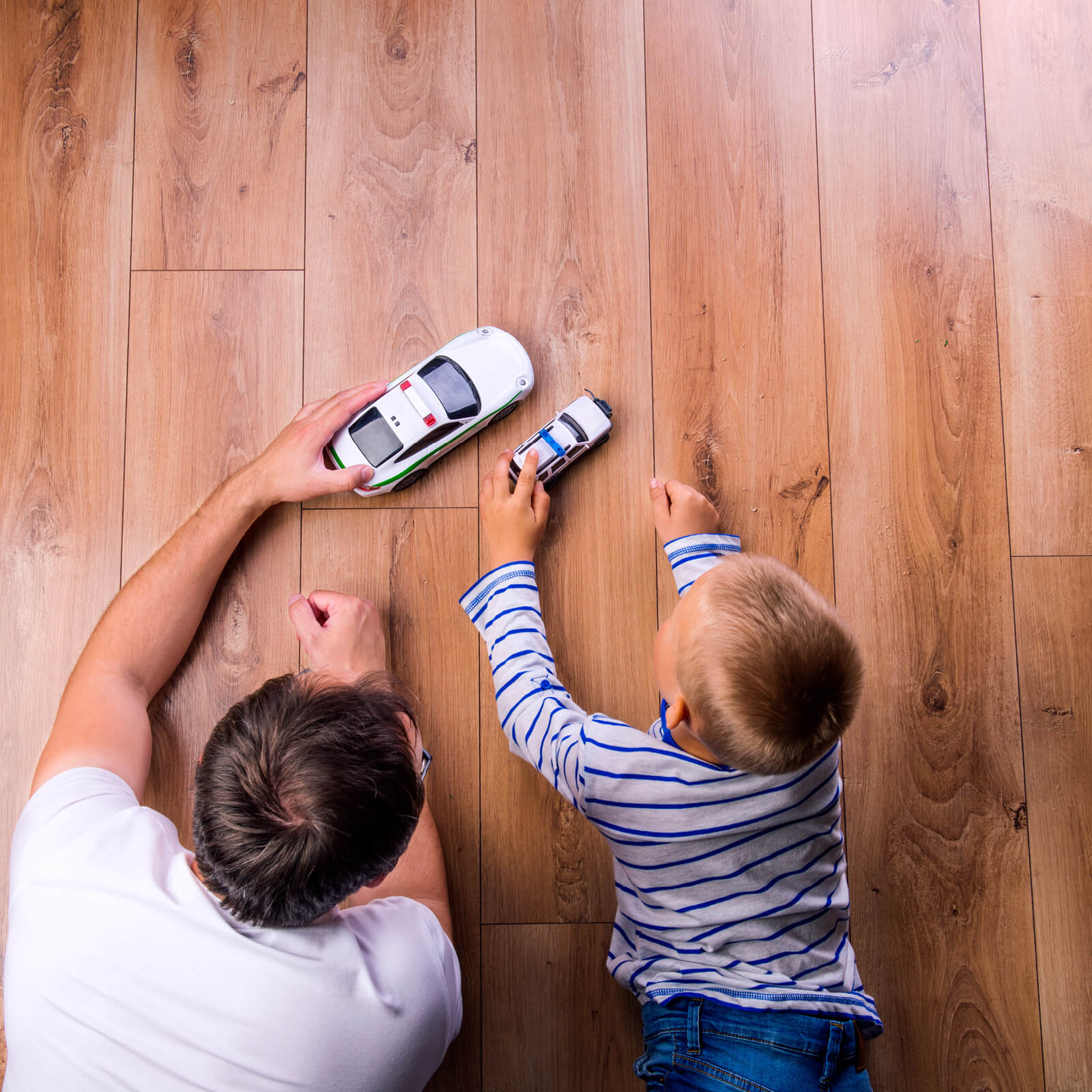 Father and kid playing with toycar | Mill Direct Floor Coverings