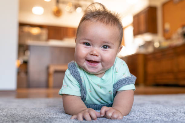 Baby laying on carpet floorings | Mill Direct Floor Coverings