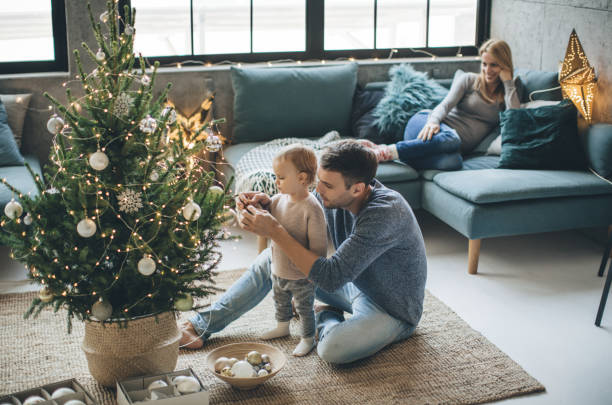 Father and daughter decorate a christmas tree | Mill Direct Floor Coverings
